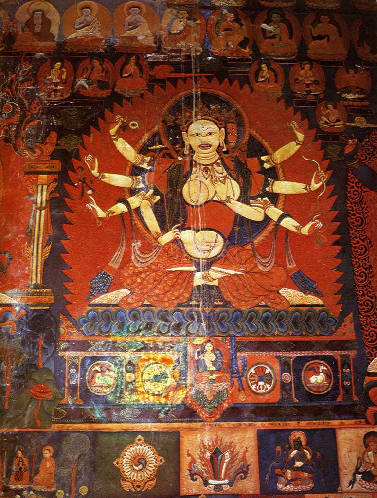 Tibet Guge 07 Tsaparang Red Temple 06 Pratisara To the right of the main door is Pratisara, with three angry faces and eight arms. She is a tantric goddess, one of the five Protectresses who are related to longevity and good deeds. In her right hands she holds the dharma wheel, an arrow, a trident-topped staff, and in her left hands she holds a vajra, a bow, and a vajra-tipped noose. Photo - Aschoff: Tsaparang - Knigsstadt in Westtibet (1997).